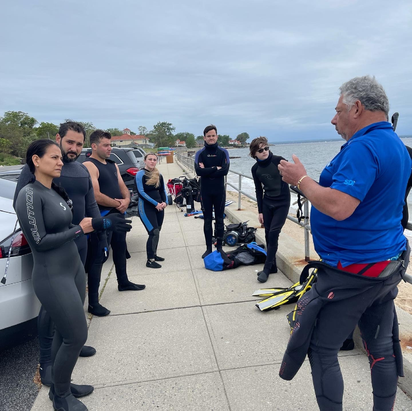 Instructor briefing divers before a shore dive