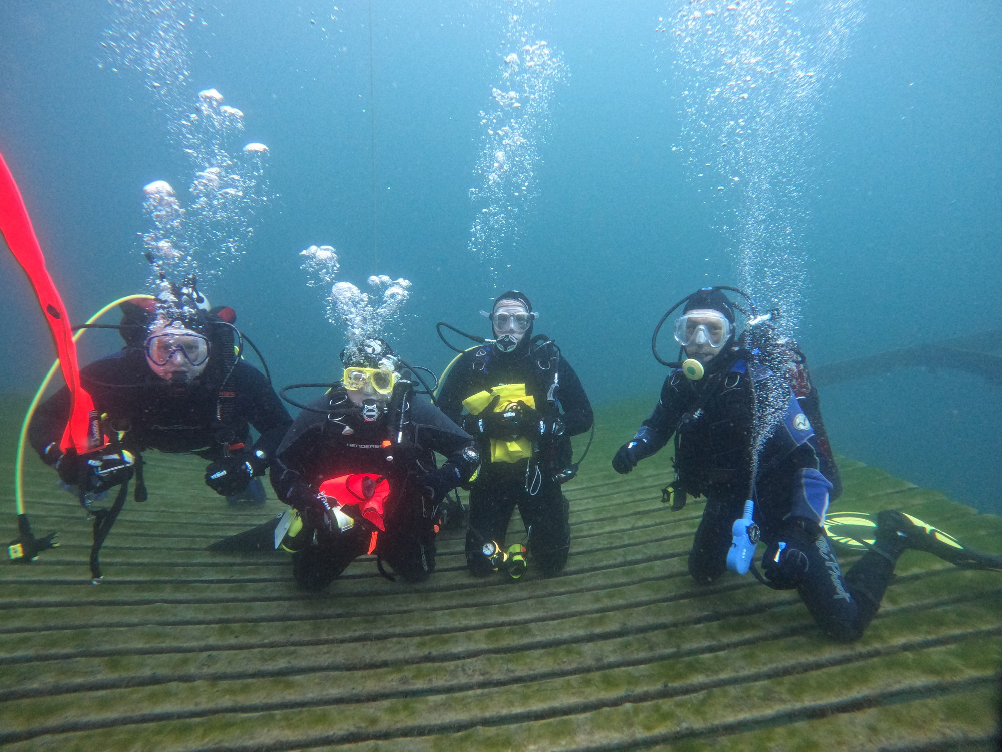 Divers underwater on a local dive